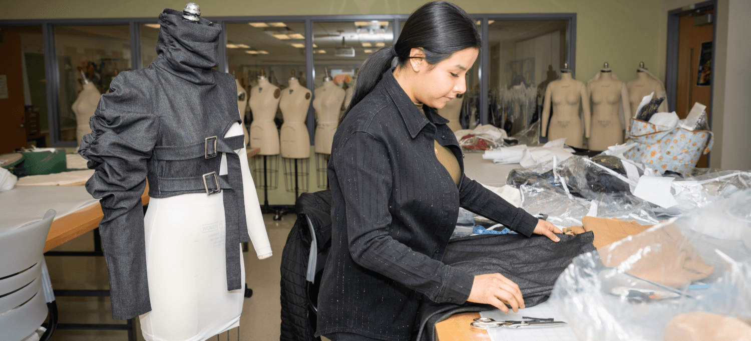 Student writing fashion notes