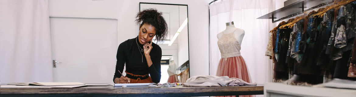 Student writing fashion notes