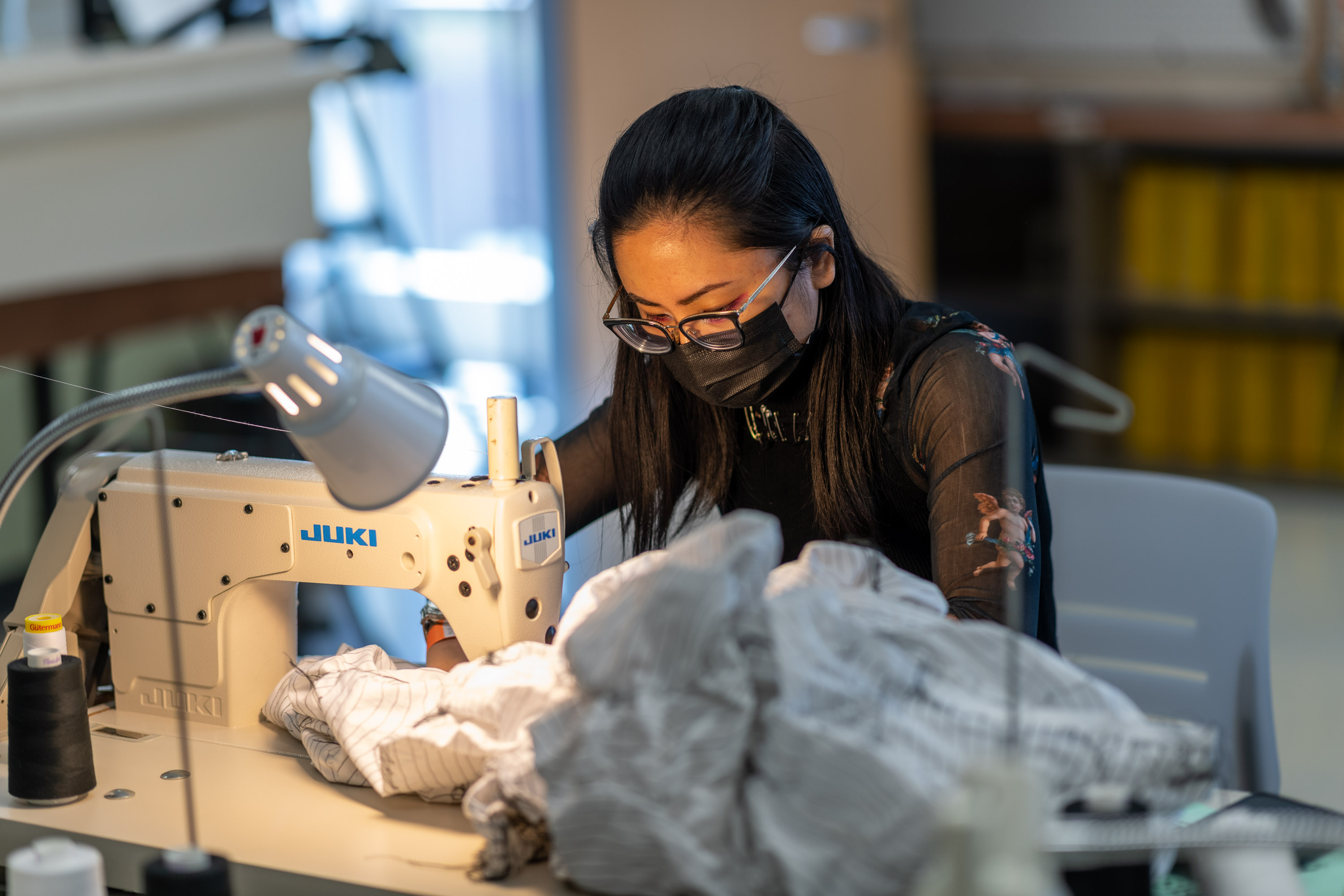 student working at sewing machine