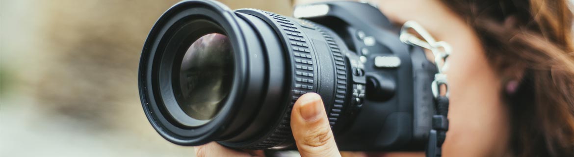 Woman taking photo using digital camera