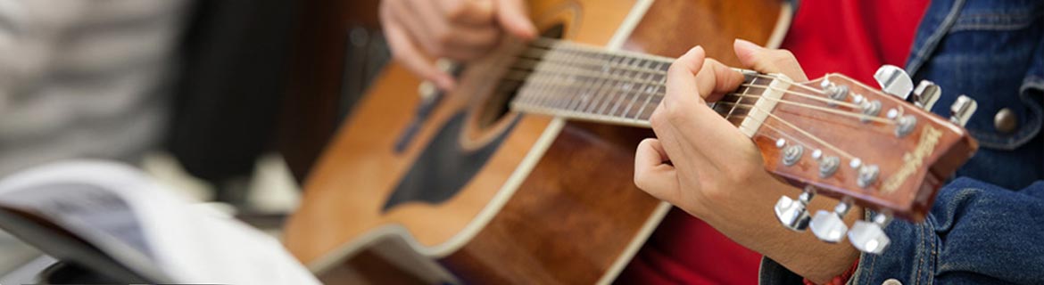Person playing guitar