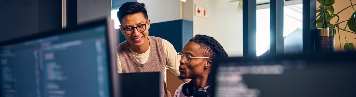 Two cloud computing analysts collaborating on a project.