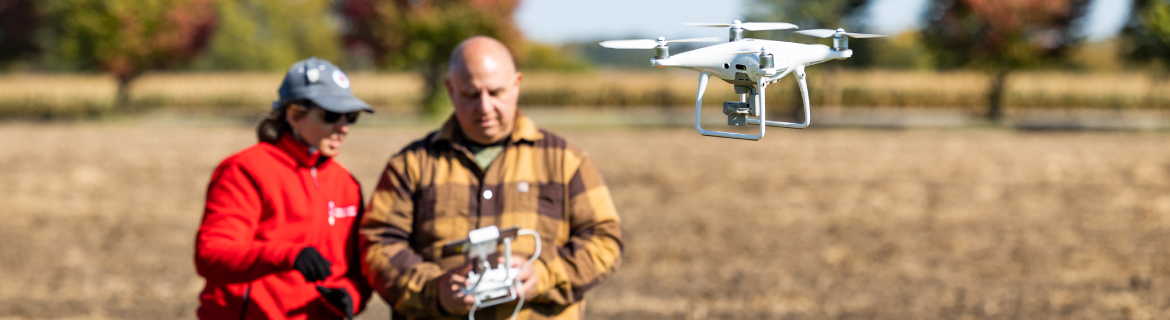 Harper Drone Program student piloting a drone under the instruction of a professor.