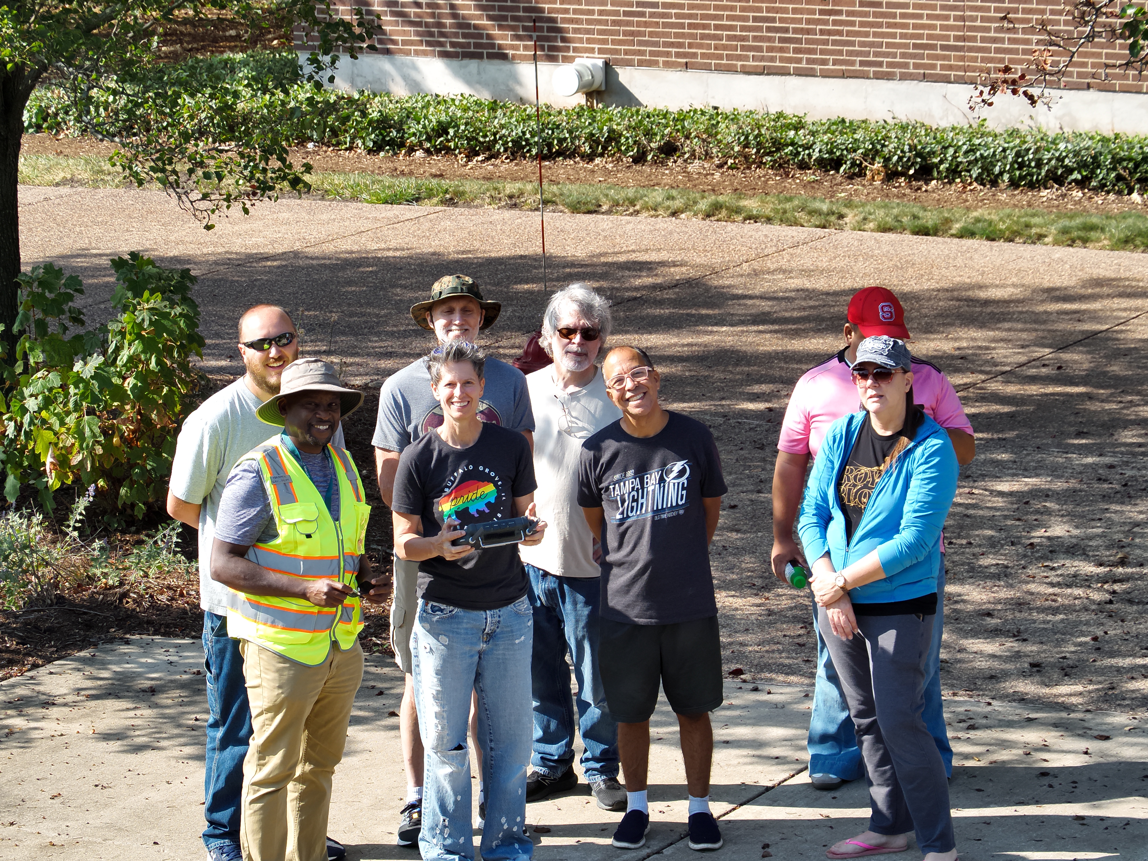 Faculty and students from a drone technology class pose for a group picture on the Harper College campus in Palatine, Illinois.