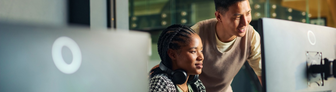 Harper College AI Cloud Computing Program Two programmers working together on a project incorporating AI into their workplace.