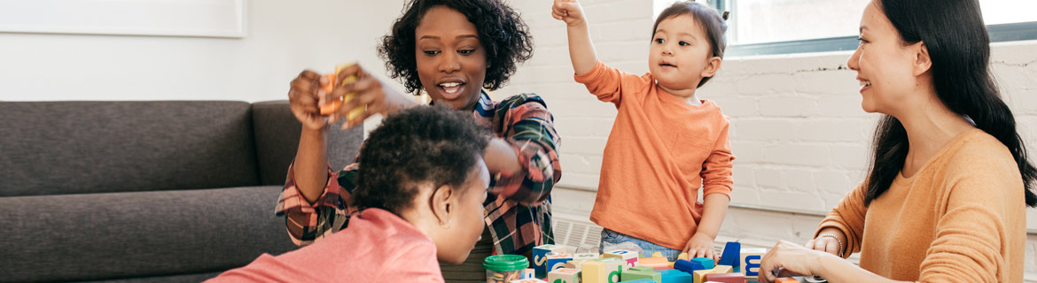 Women playing with children