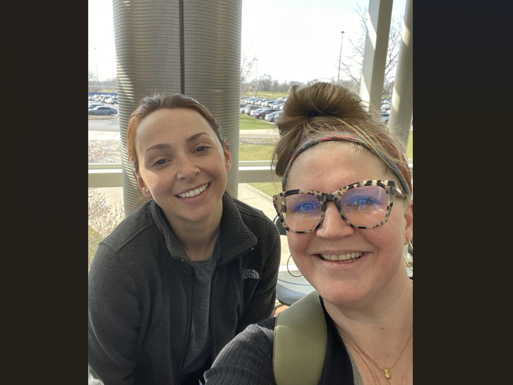 Student and program director Traci Wessl smile together
