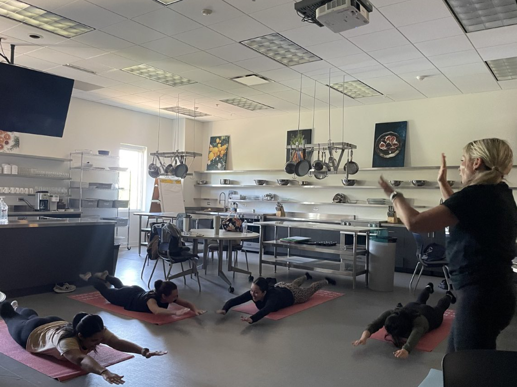 Dietetic Internship students do yoga in Nutrition Lab classroom area