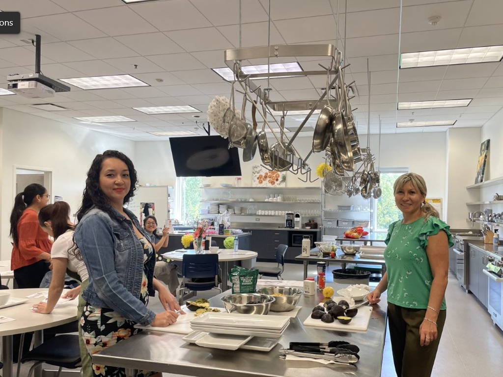Students work with food in the Nutrition Lab kitchen area