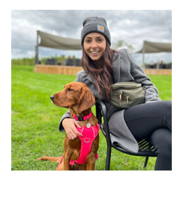 Brigid poses for a photo with her dog