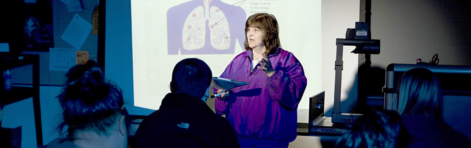 Instructor talking to students