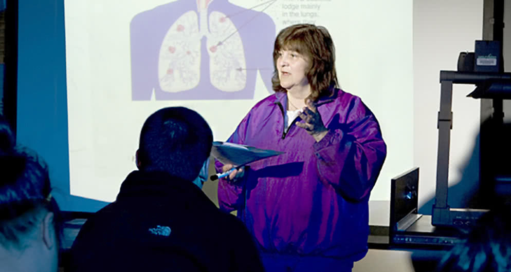 Male teacher teaches students about well-being