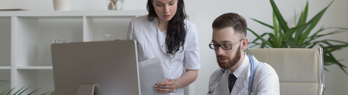 Medical professionals examining documents