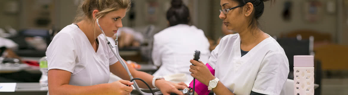 Nursing assistants examining