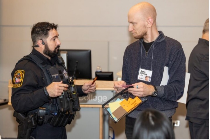 Police officer chatting with someone at event