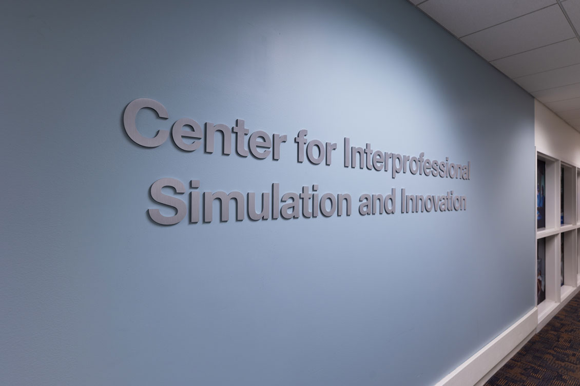 Sign reads "Center for Interprofessional Simulation and Innovation"