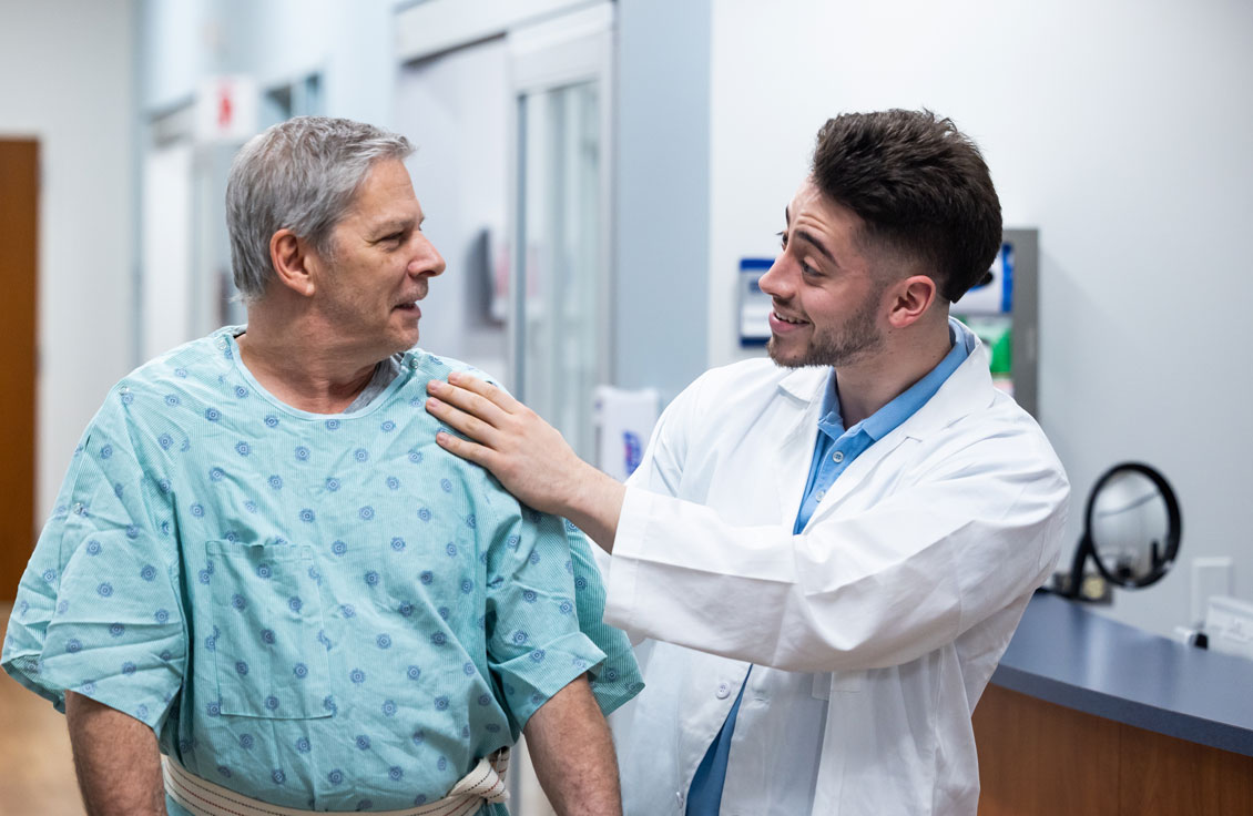 close up of student talking to simulation patient