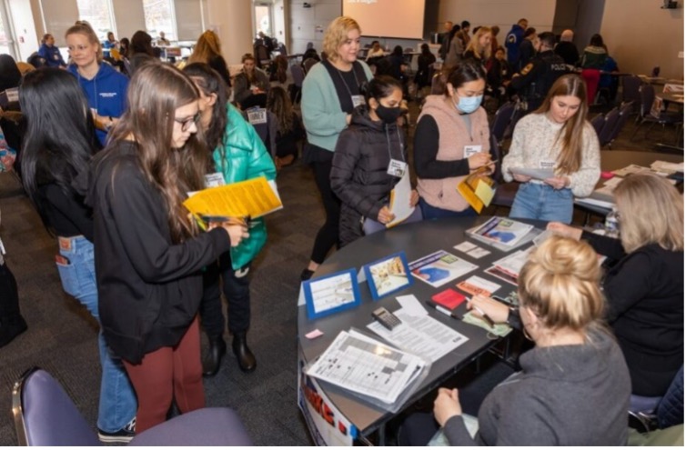 Students at event table