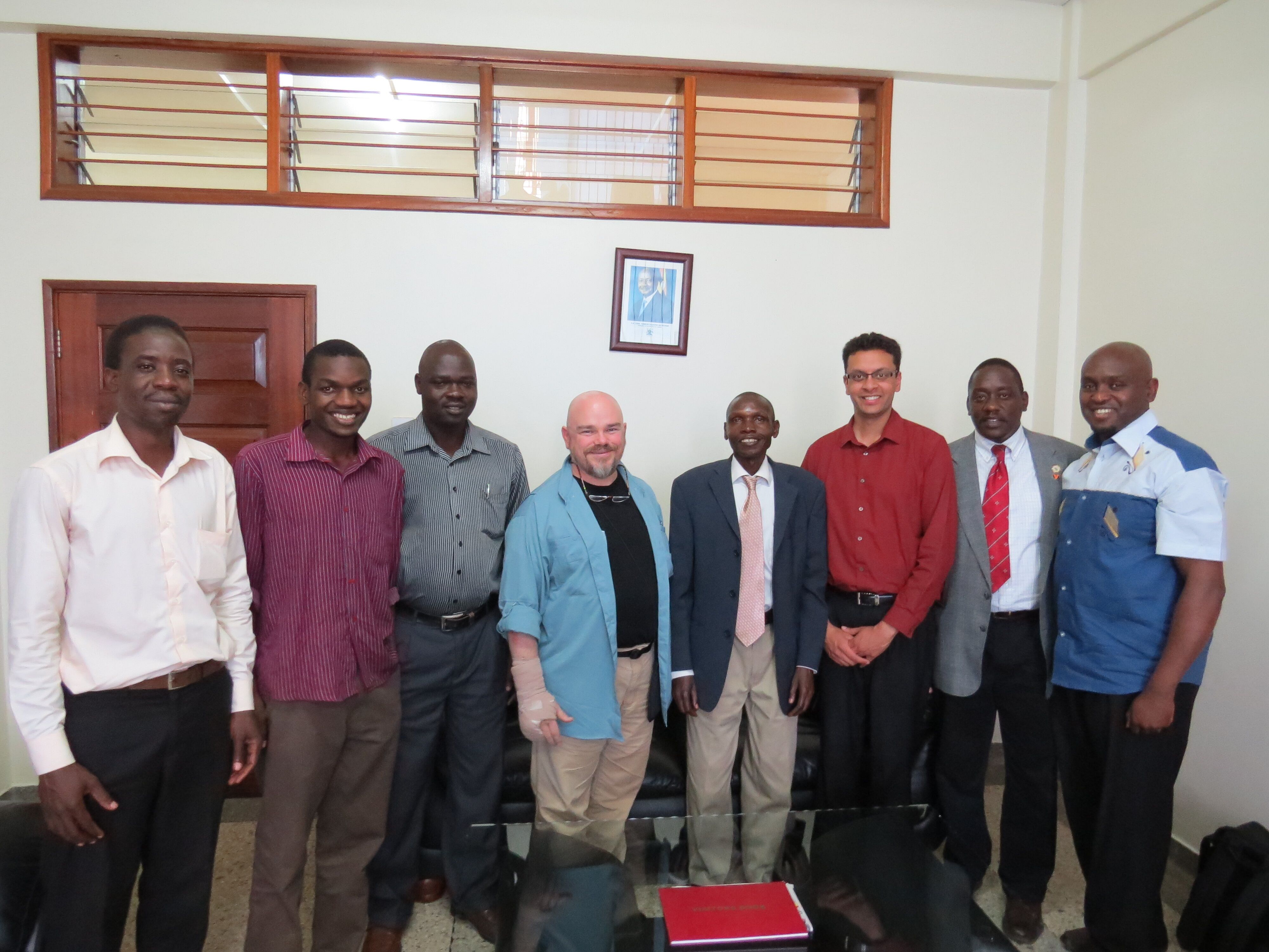 Harper and Ugandan faculty standing in Mbarara University