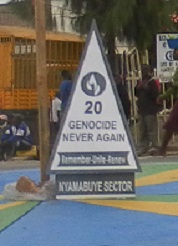 Sign that reads "“Genocide Never Again. Remember – Unite – Renew.”
