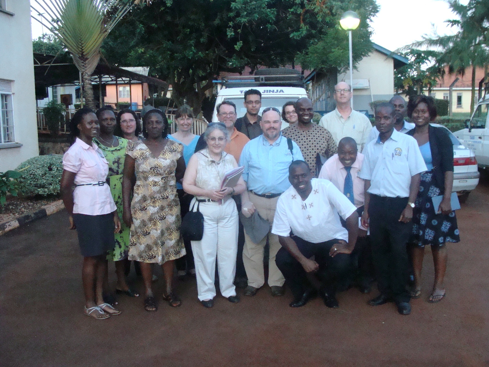 a group photo of visiting professors with local professors in Uganda
