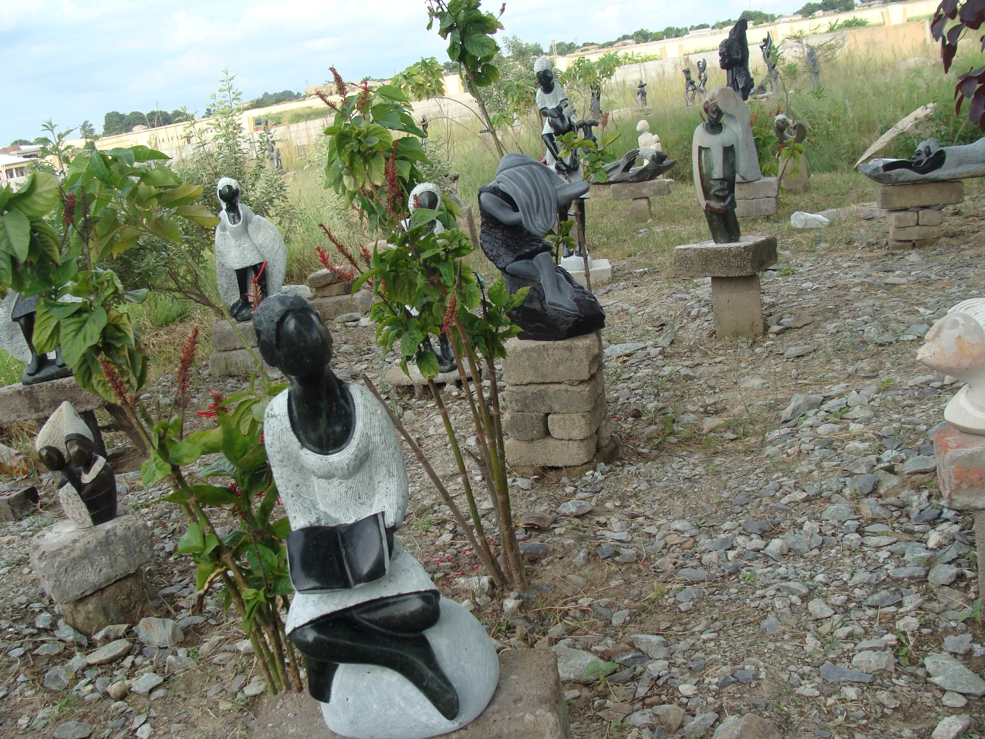 Close up view of African head sculptures outside 