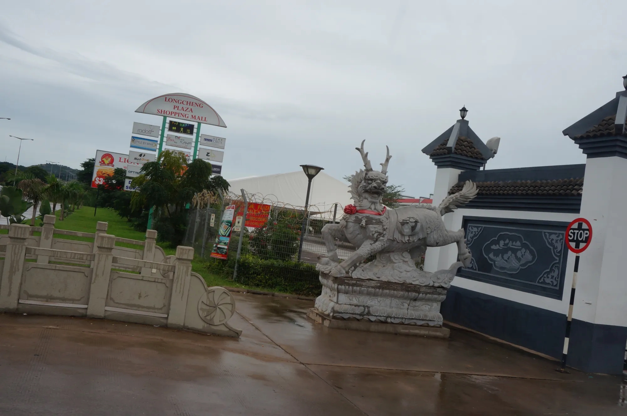 Empty shopping plaza with Chinese motifs like a large lion statue 