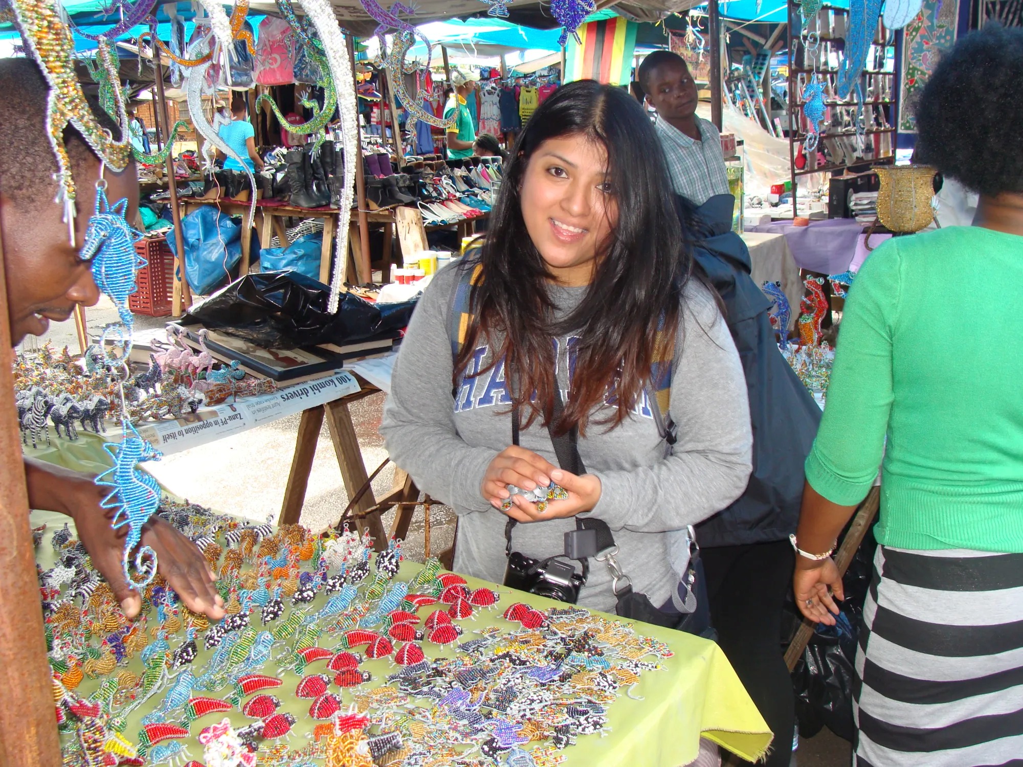 Woman in flea market with beautiful trinkets 