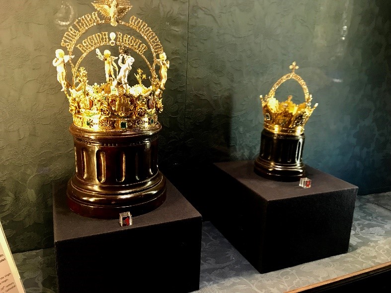 Two gold and jewel-wncrusted crowns, one large and small, in the Seville Cathedral