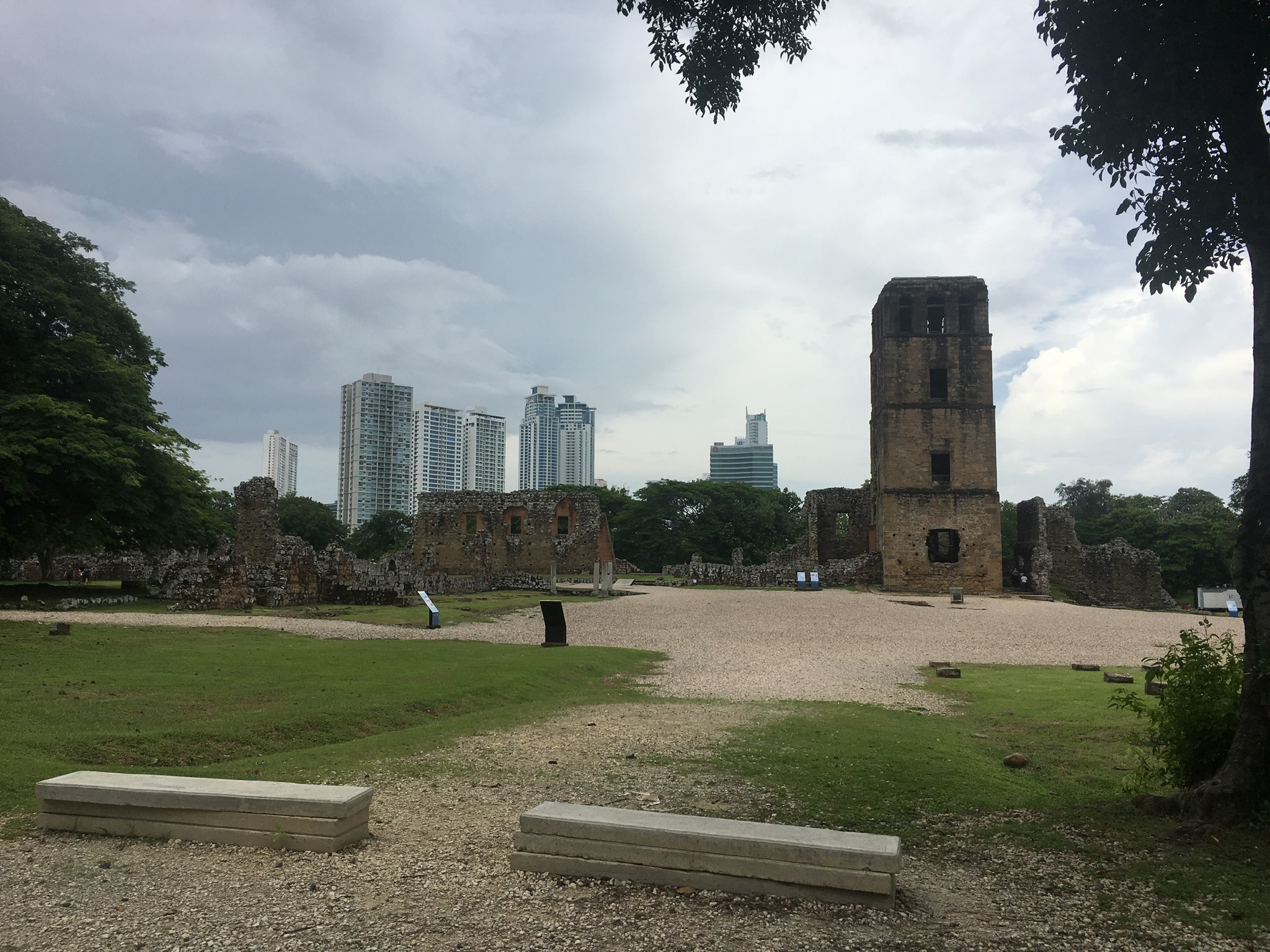 The old Cathedral's tower stands over the archeological site with modern towers in the background