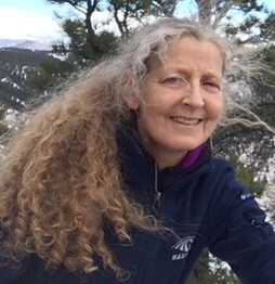 Julie Ellefson smiles while sitting outside