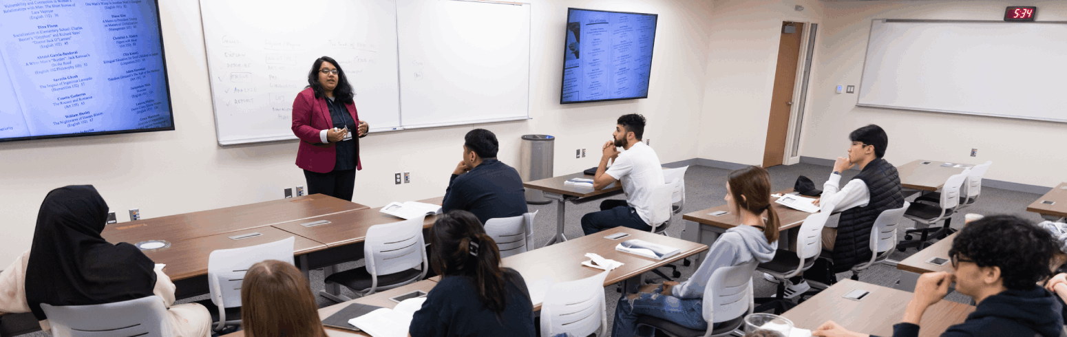 Harper College professor presenting a lesson to Linguistics program students in a classroom on the Harper campus in the Chicago suburbs.