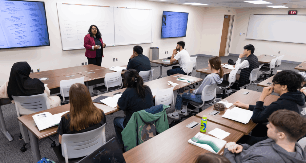 Harper College professor presenting a lesson to Linguistics program students in a classroom on the Harper campus in the Chicago suburbs.