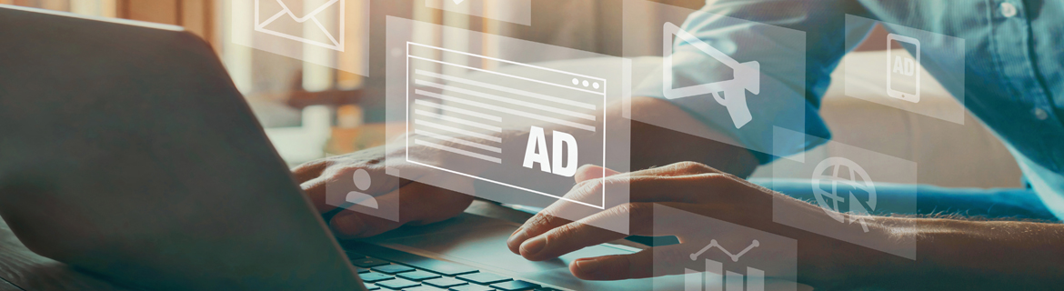 Person on laptop creating advertisements