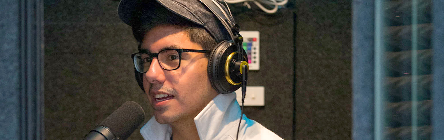 Student speaks on air at Harper's radio station