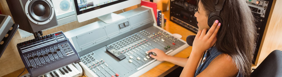 Girl changing sound frequencies on a machine