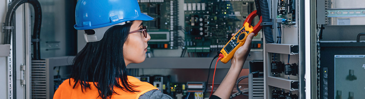 Woman working with electronic maintenance technology