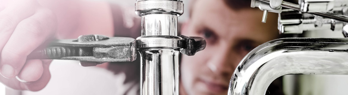 Man examining faucet structure