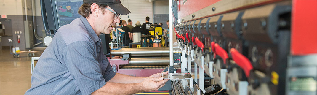 Man working with manufacturing machinery