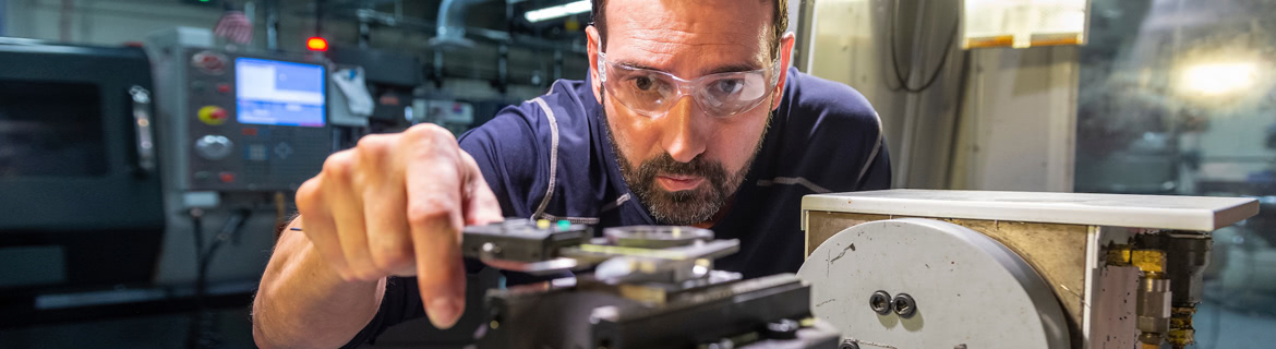 Man working with manufacturing machinery