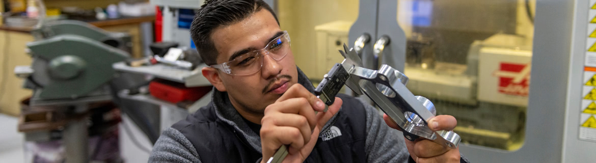 Man working with manufacturing machinery