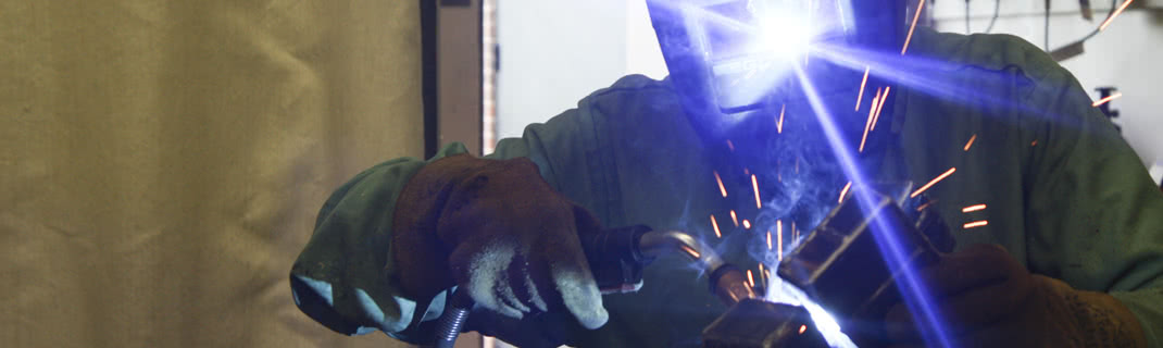 Man working with welding technology and machinery