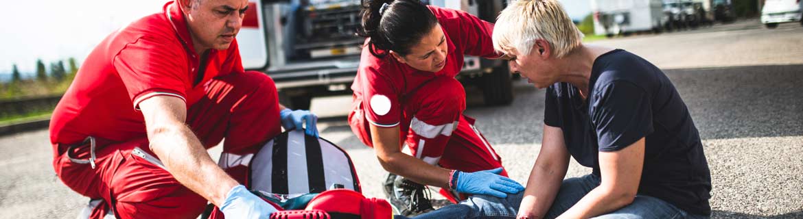 Paramedics assist an injured person
