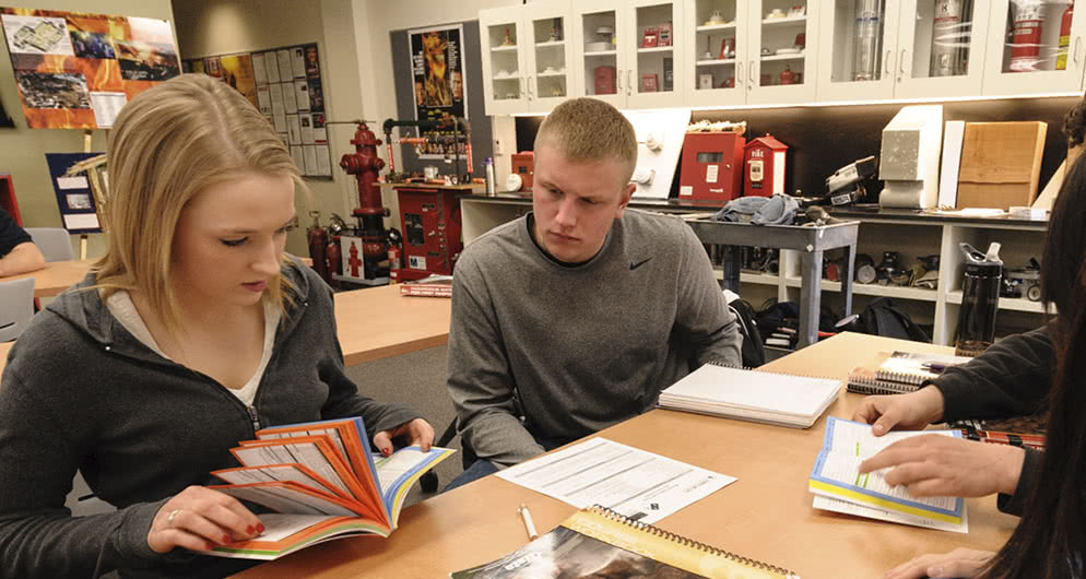 Students work as a group in a fire science class.