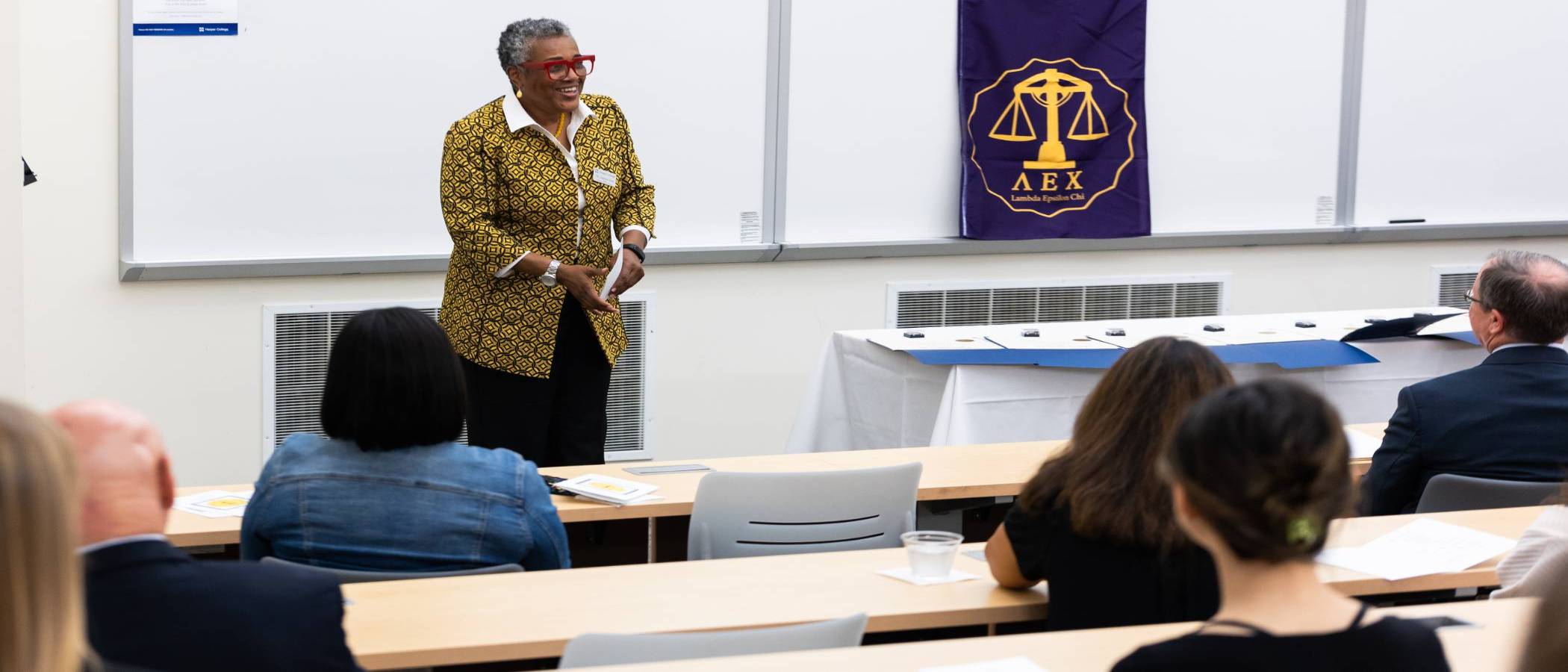 Harper Legal Studies program professor giving a speech at a Paralegal pinning ceremony on Harper College's campus in the Chicago suburbs.