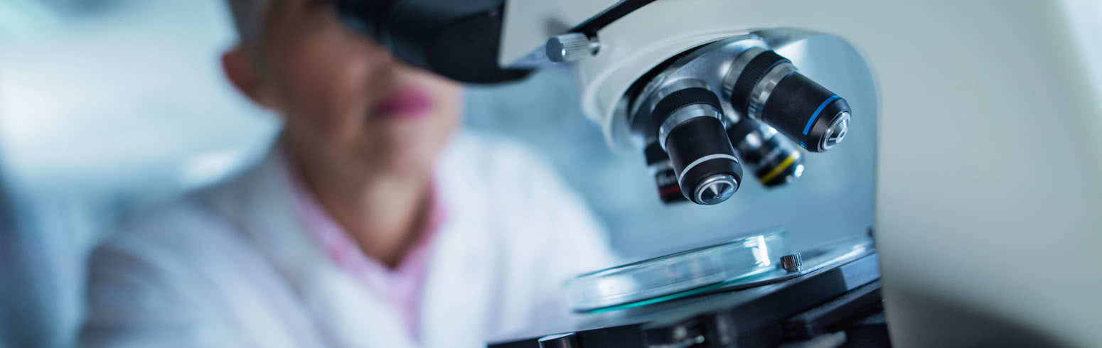 Lady working with microscope