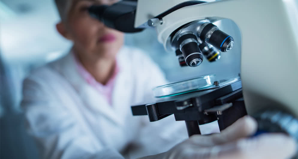 Lady working with microscope