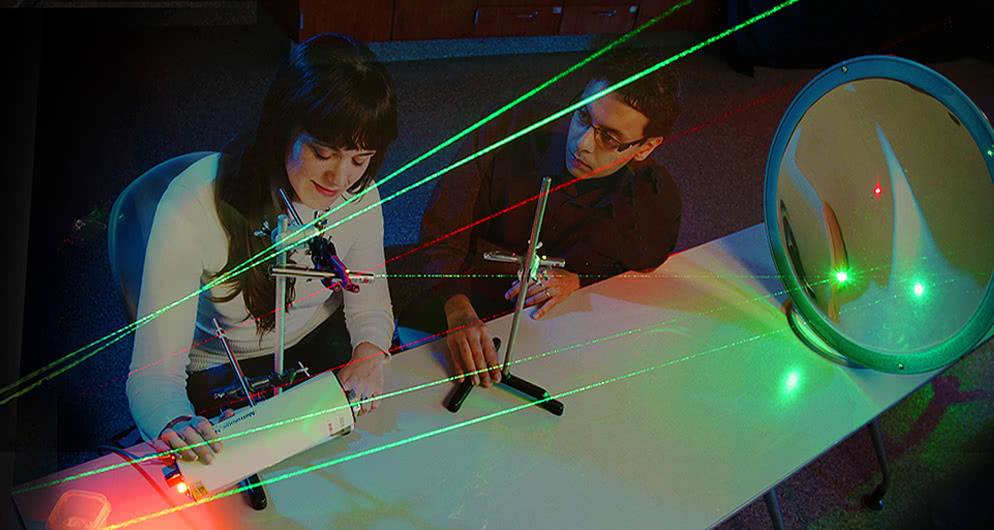 Researchers work in a greenhouse.
