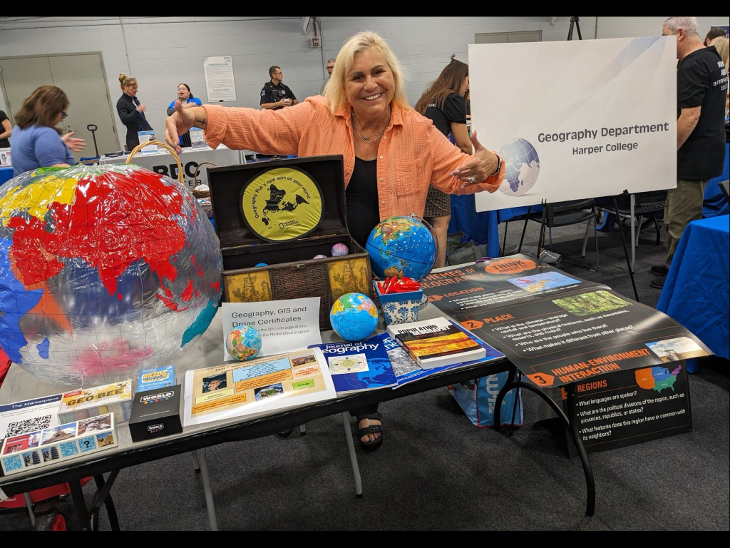 Department Chair Veronica Mormino represents Harper's Geography program during an open house event.
