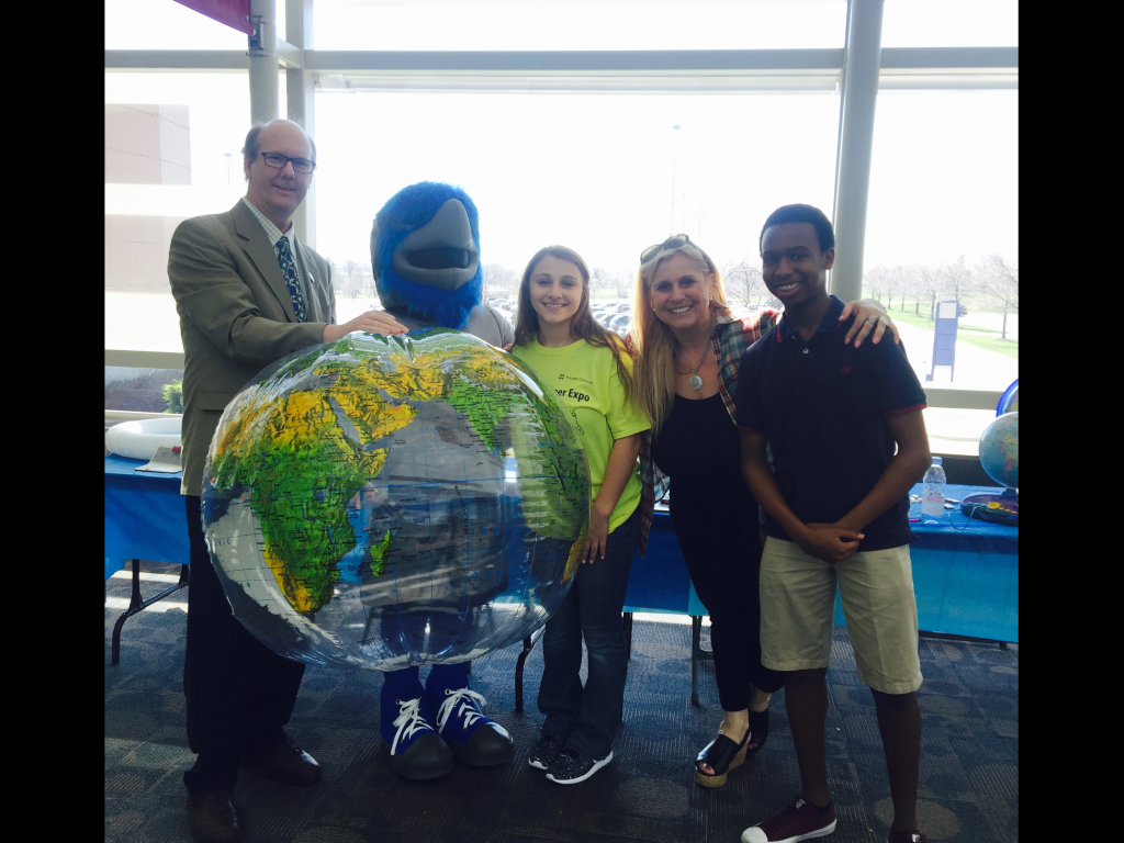Veronica Mormino and Harper Geography students pose with the college mascot.